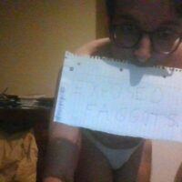 My face with a paper say exposed faggots
